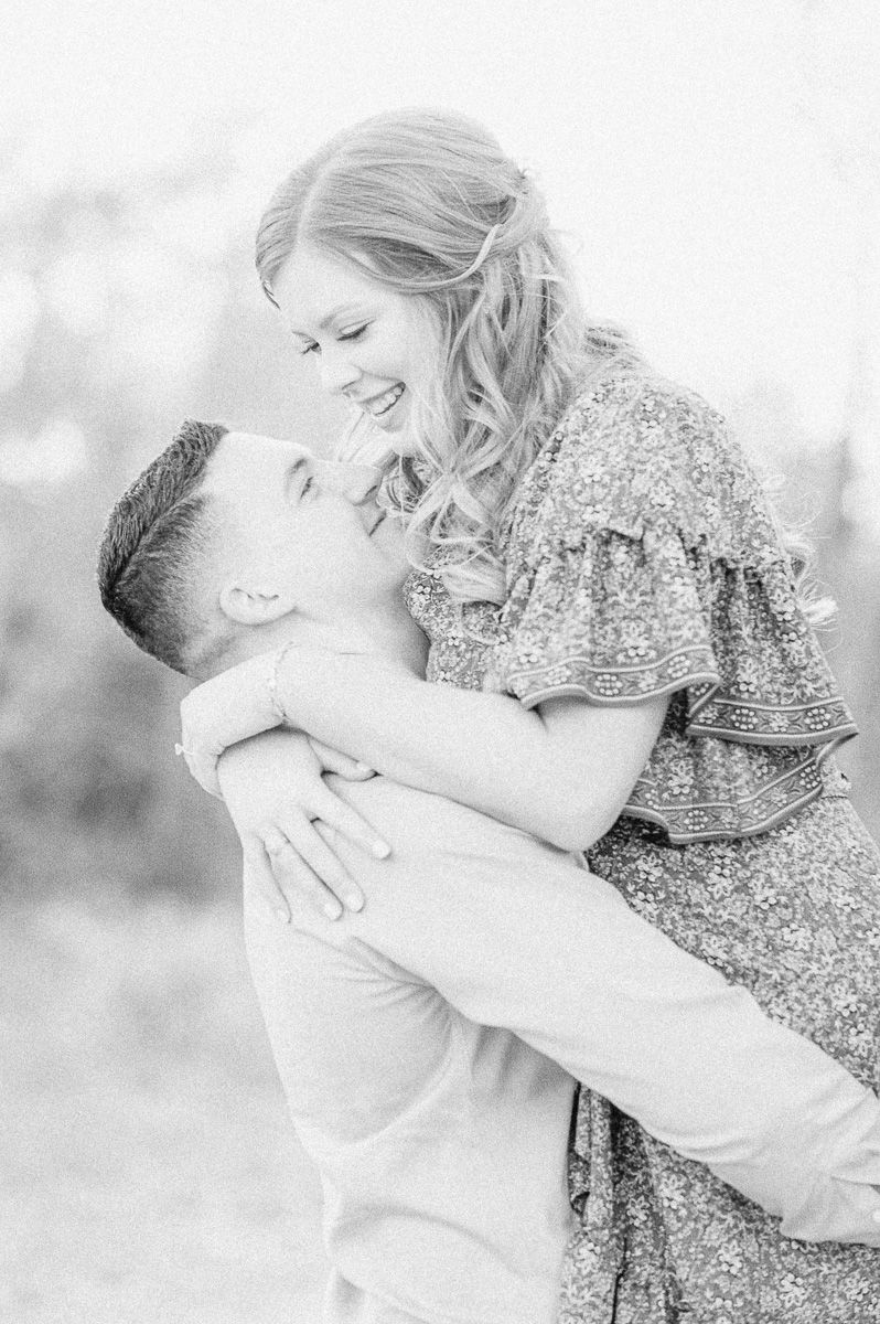 Couple cuddling during their Cypress engagement session