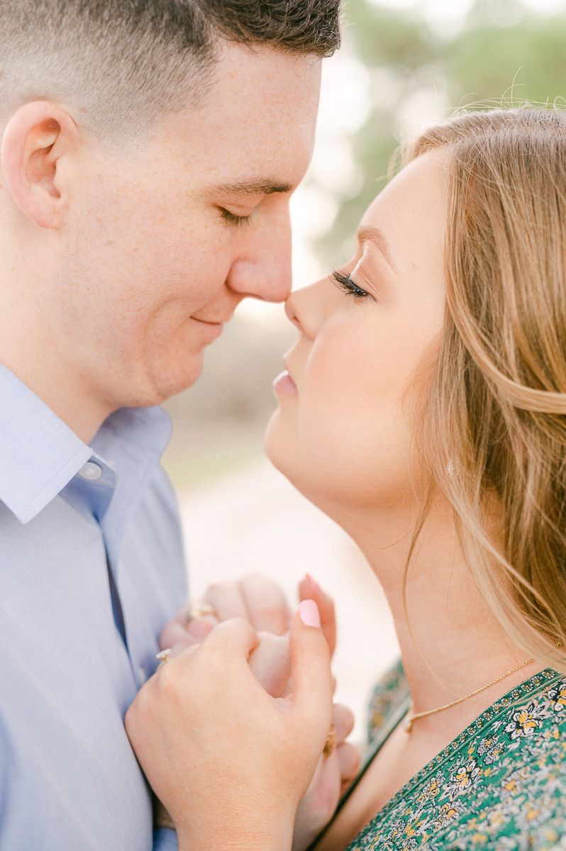 Couple cuddling during their Cypress engagement session