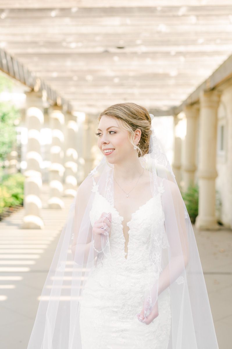Bride holding veil at Ashton Gardens North Houston bridal session