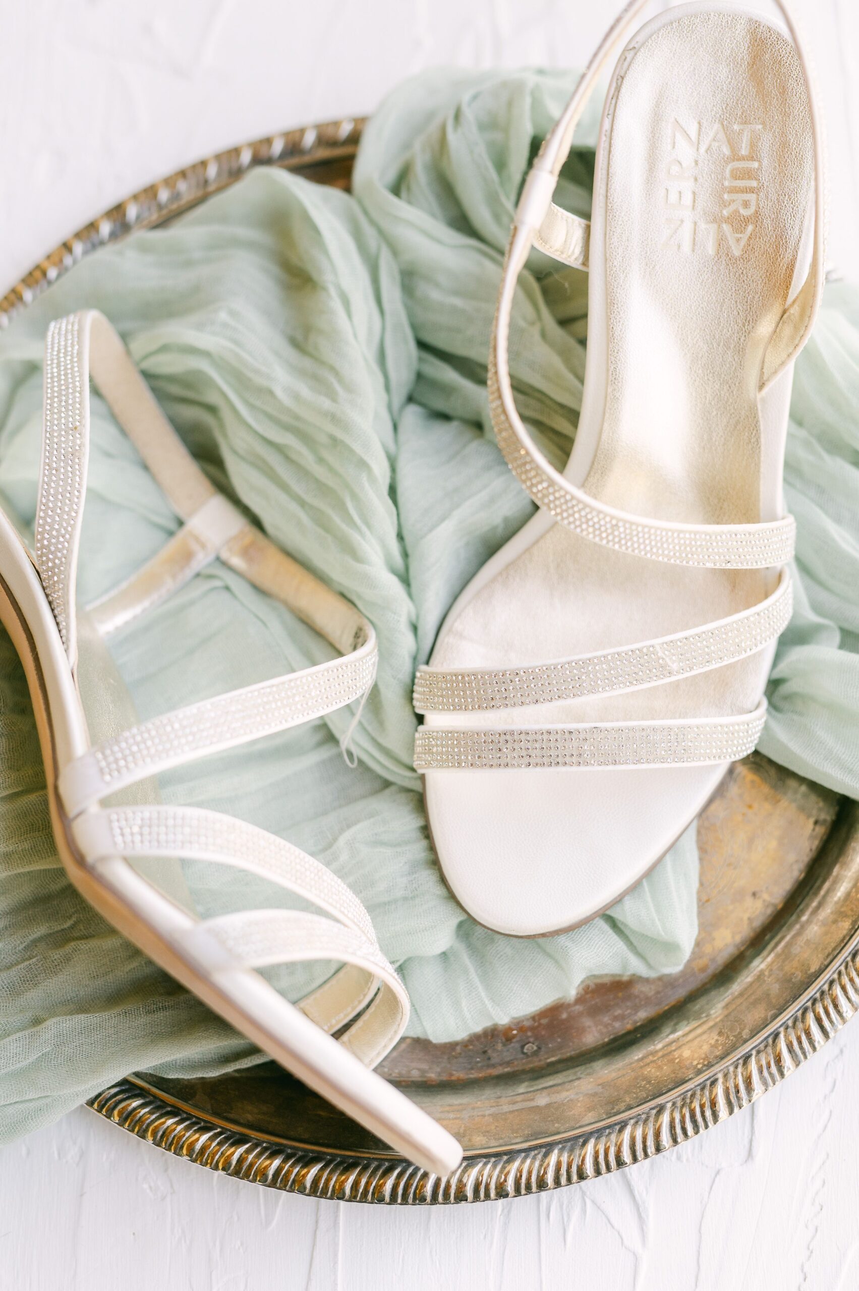wedding shoes on mint green fabric