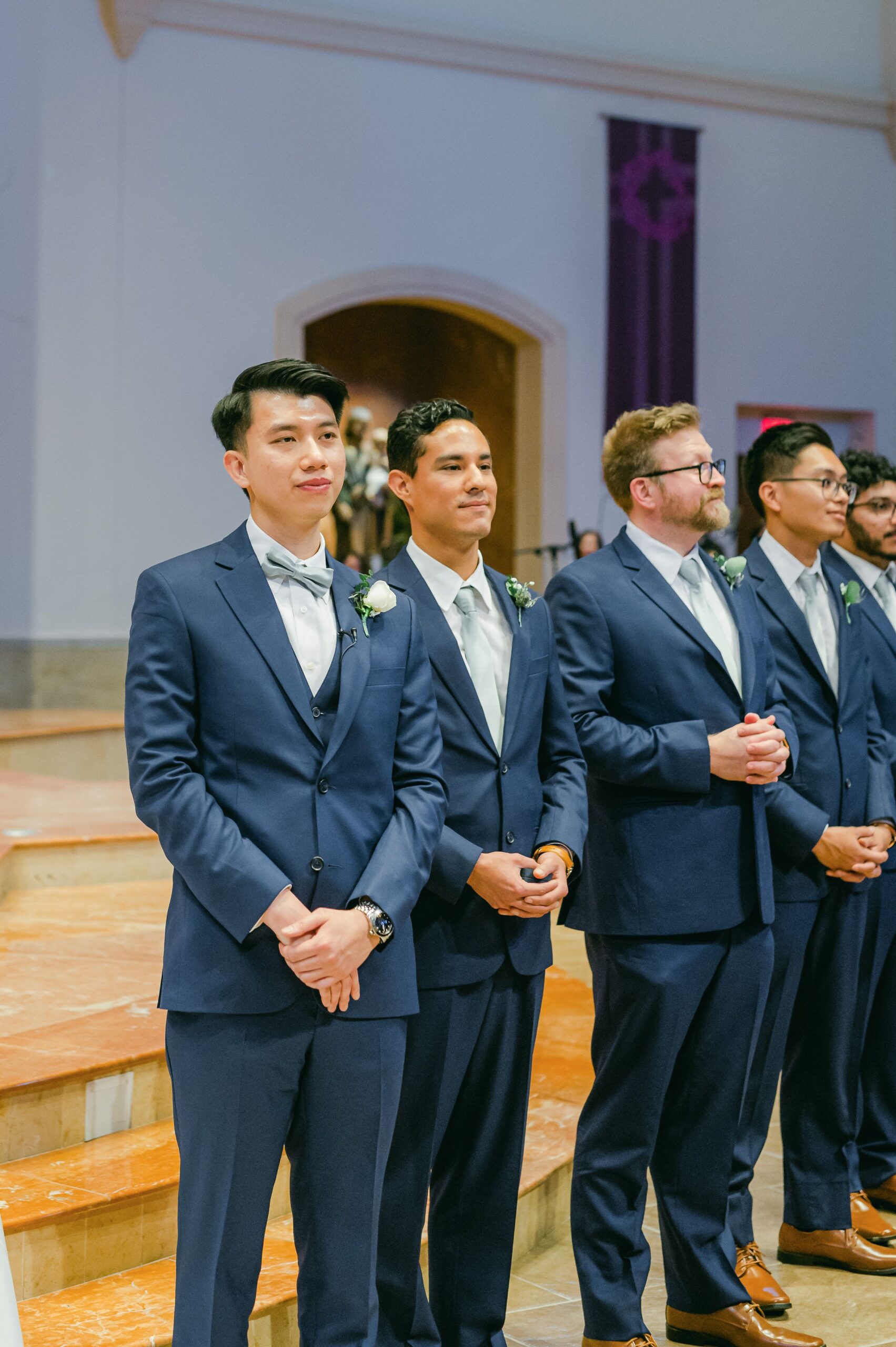 groom seeing his bride walk up the aisle at Our Lady of Lourdes