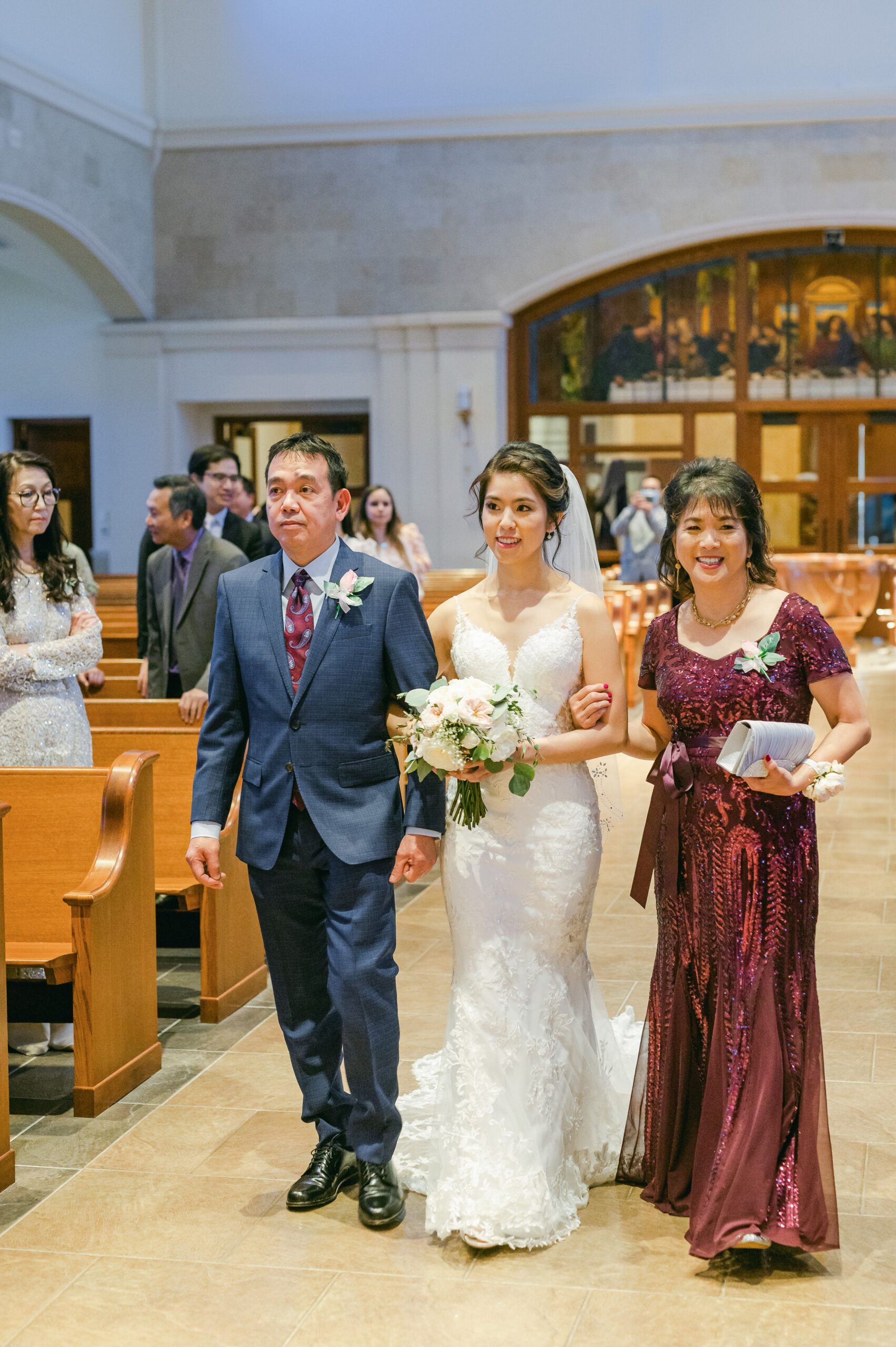bride walking up the aisle at Our Lady of Lourdes