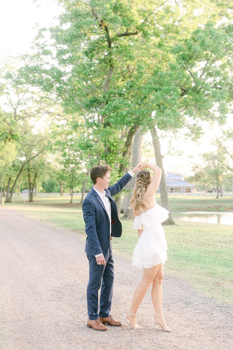 couple dancing during engagement session in Texas