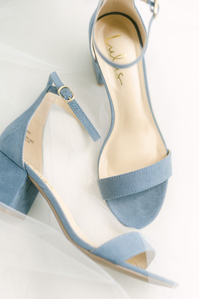 blue wedding shoes on veil