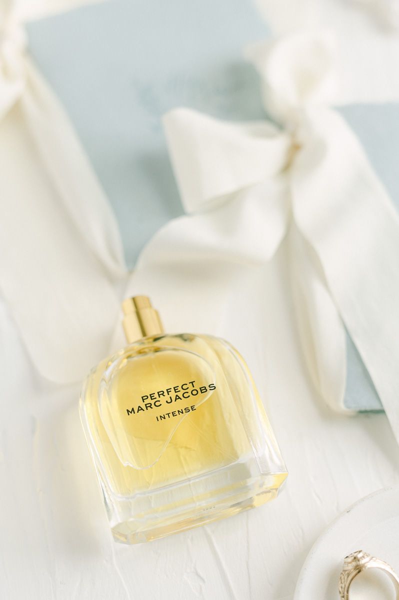 wedding perfume with blue vow books