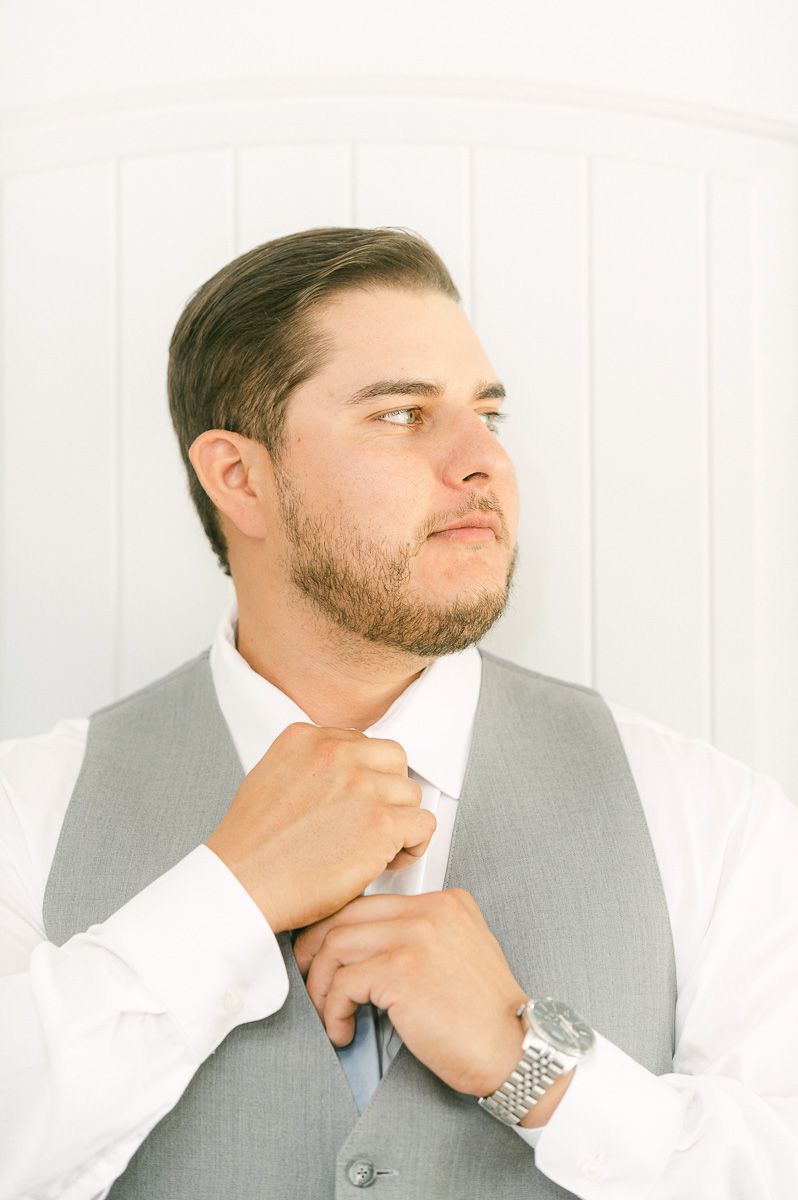 groom getting ready before wedding ceremony 