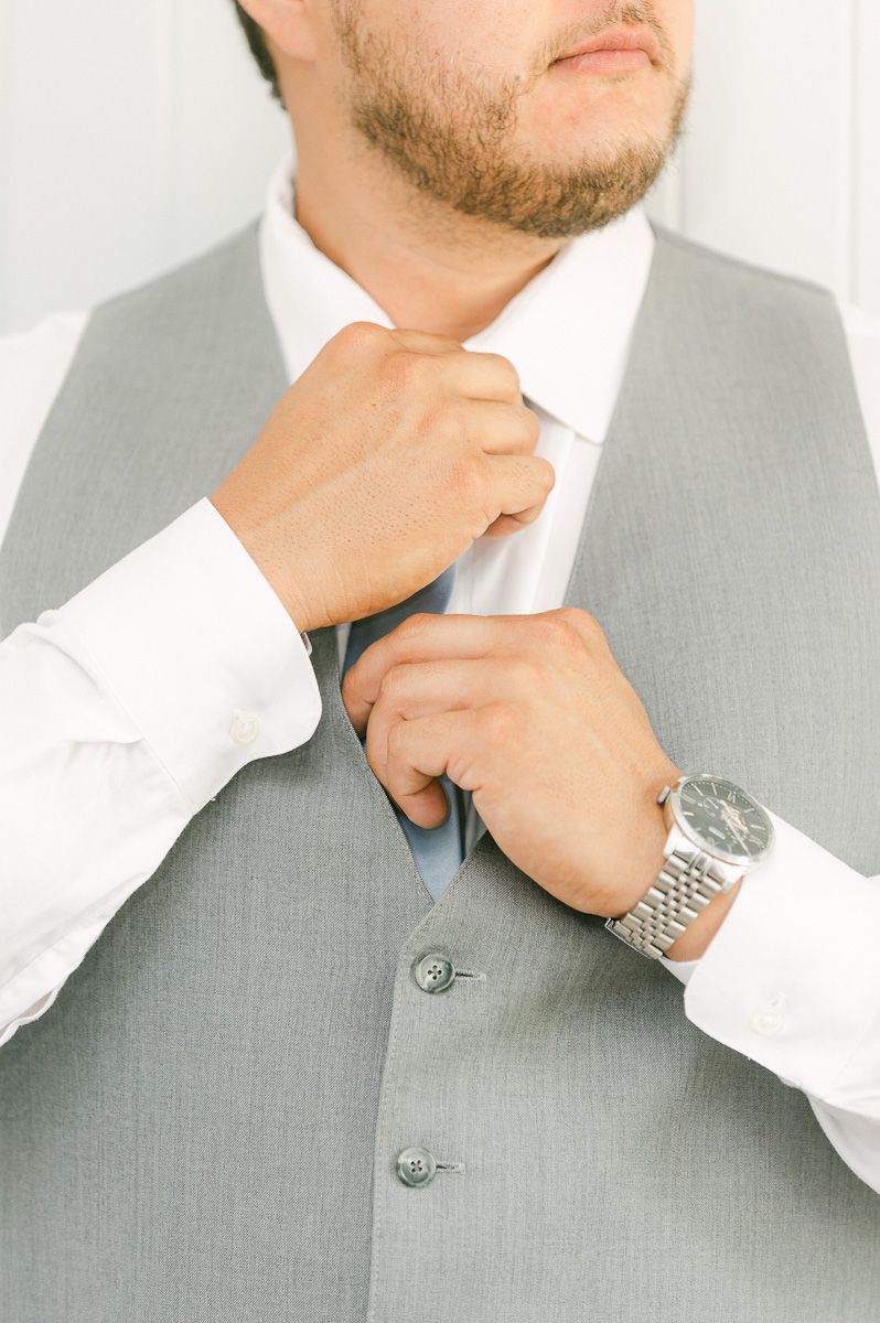 groom getting ready before wedding ceremony 