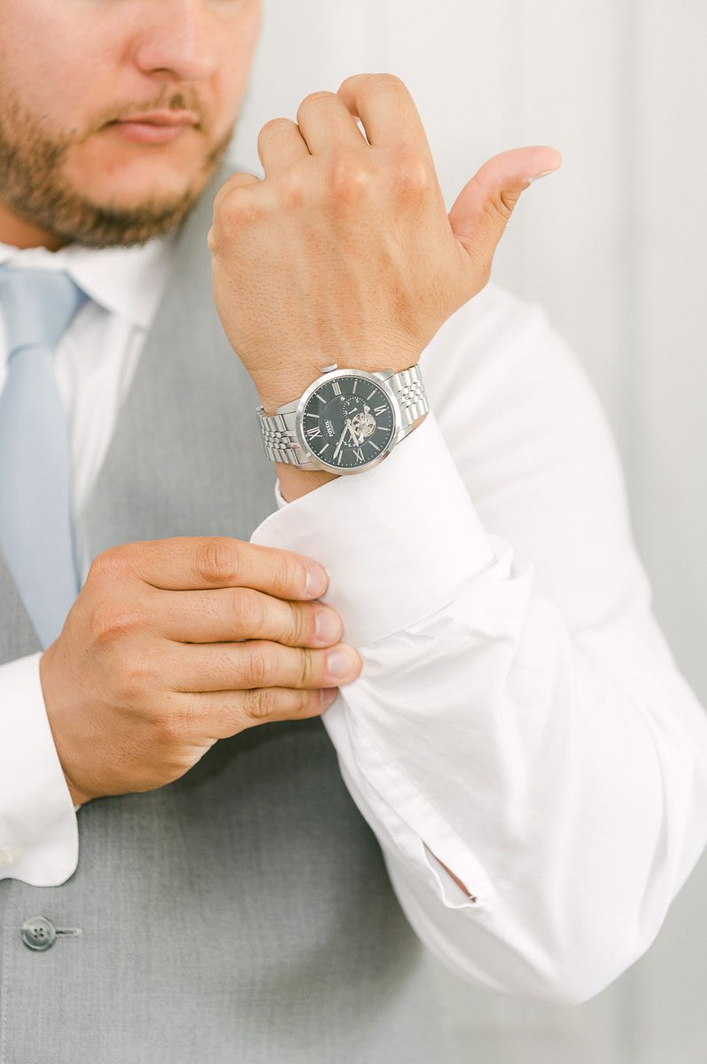 groom getting ready before wedding ceremony 