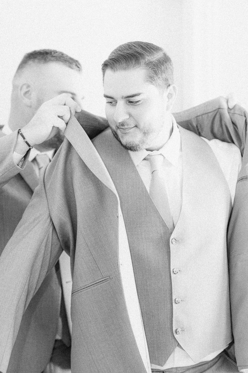groom getting ready before wedding ceremony 