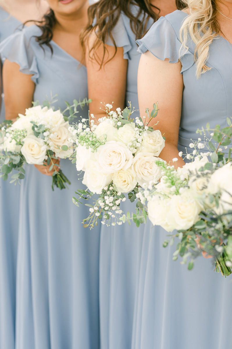 white flowers with blue accents for bridesmaids