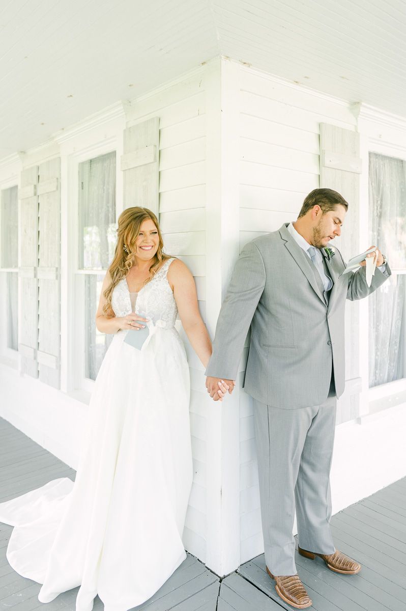 first touch between bride and groom on porch at The Pattison House