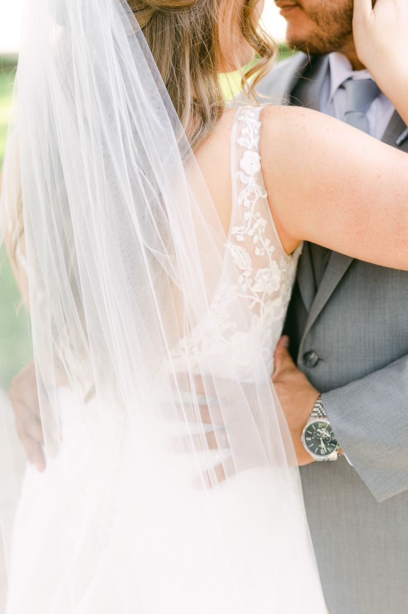 bride and groom under large tree in Pattison, Tx