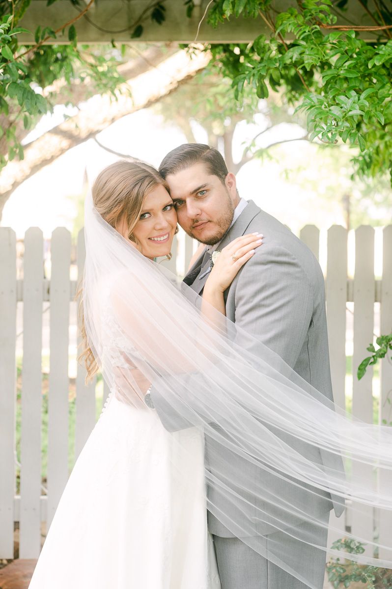 bride and groom cuddling on wedding day