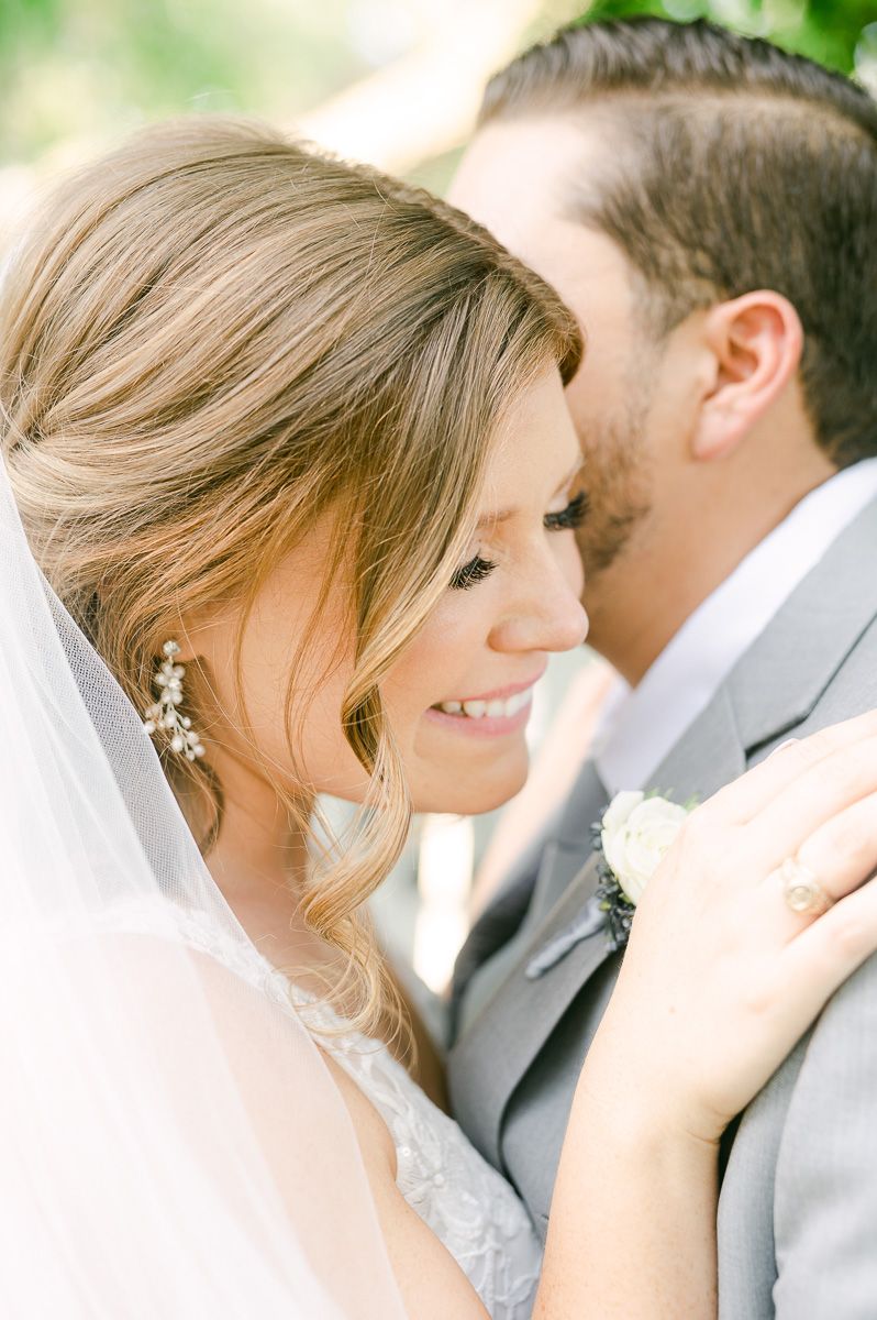 bride and groom cuddling on wedding day