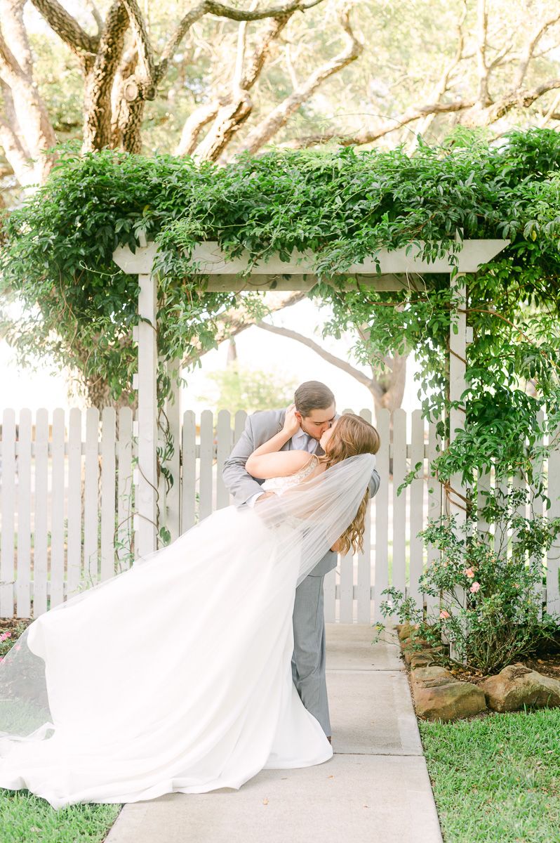 bride and groom kissing on wedding day