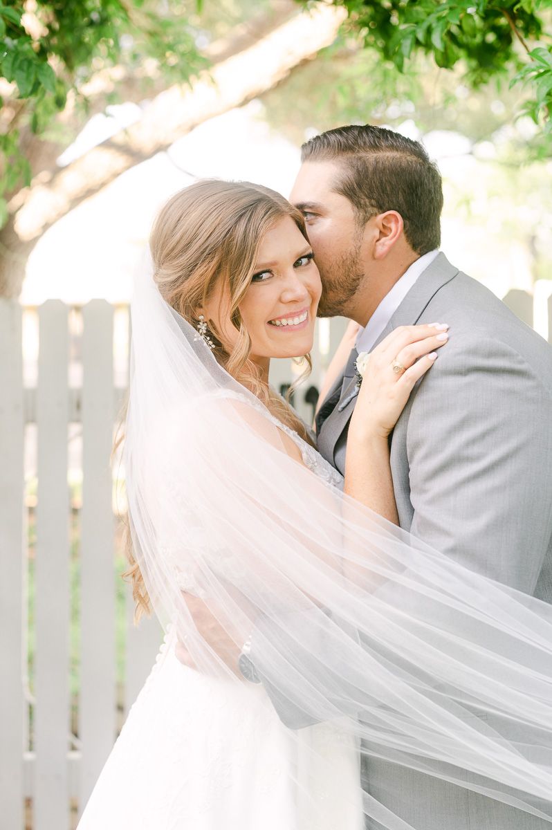bride and groom cuddling on wedding day