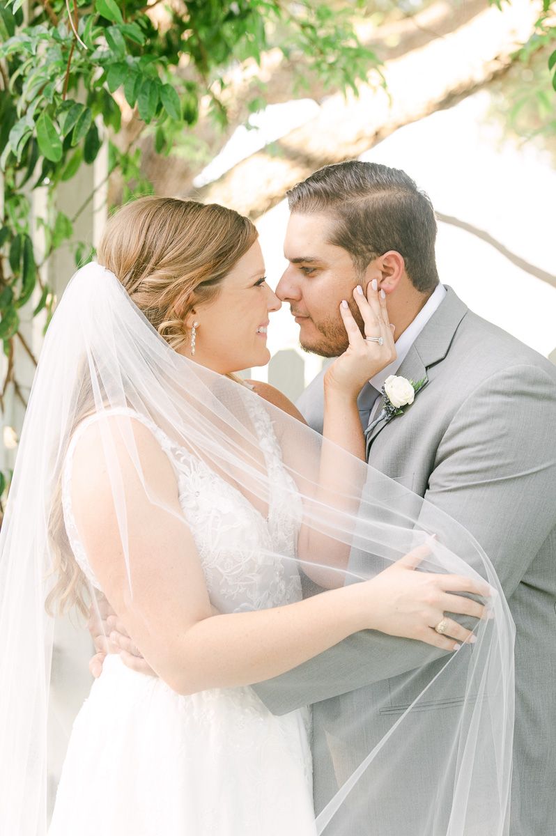 bride and groom cuddling on wedding day