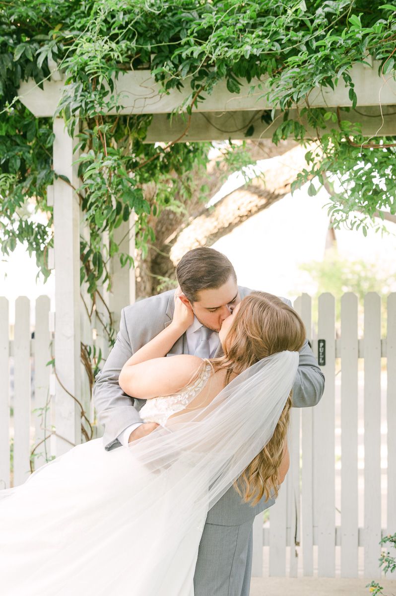 bride and groom kissing on wedding day