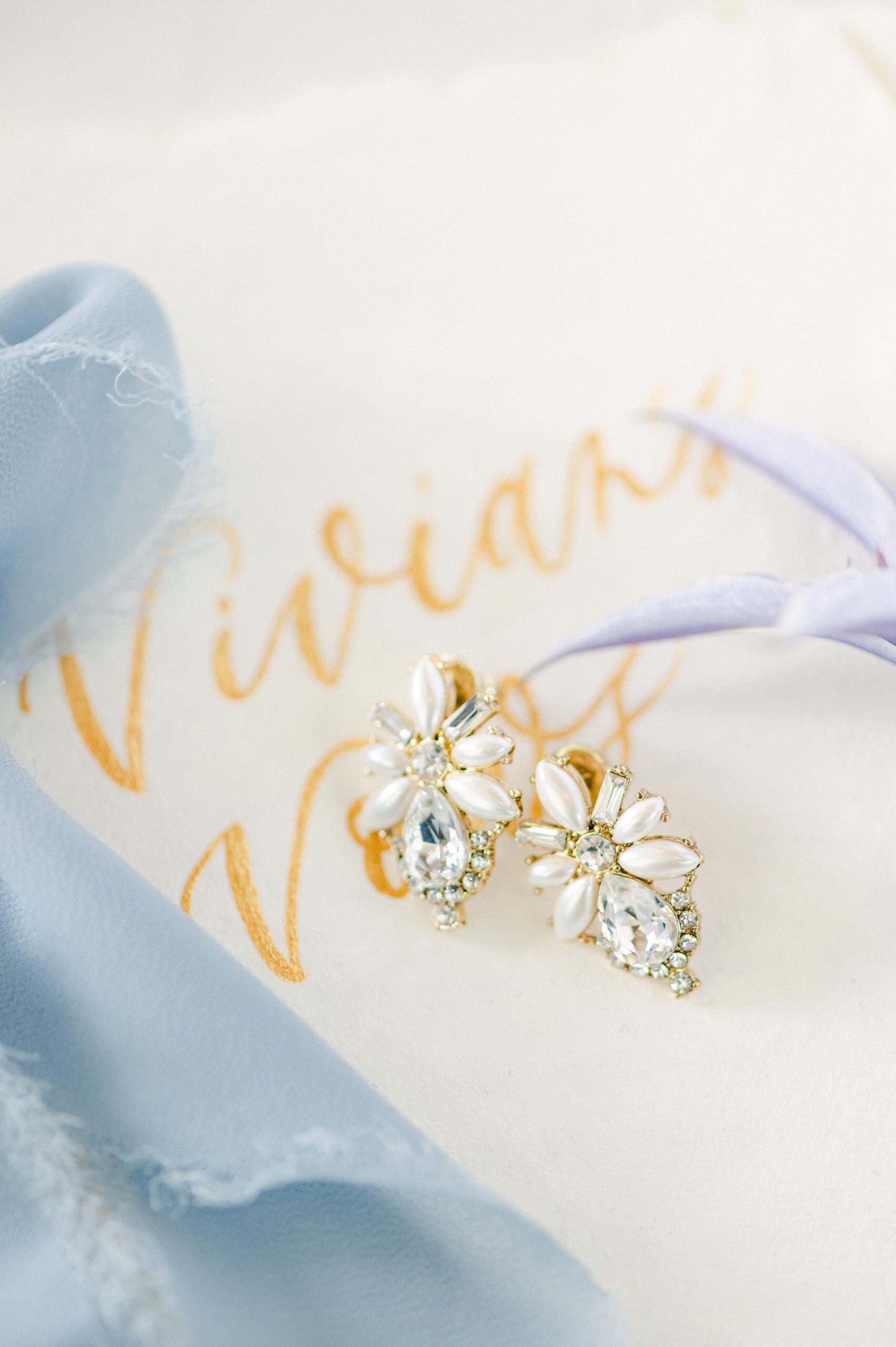 wedding earrings on vow book