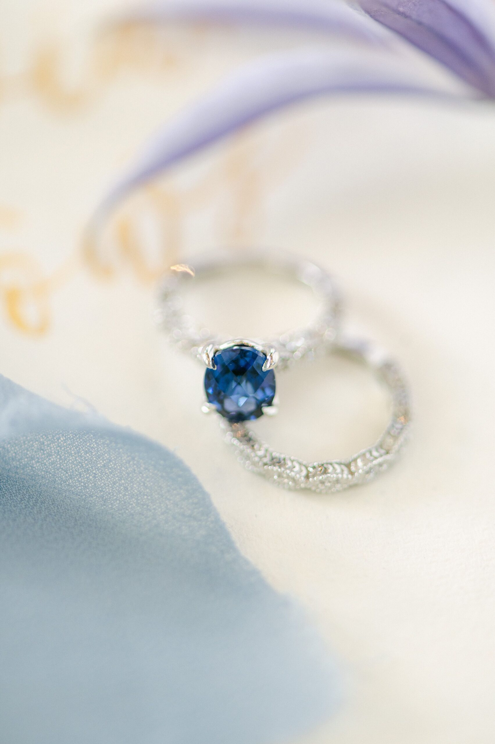 blue engagement ring on vow book