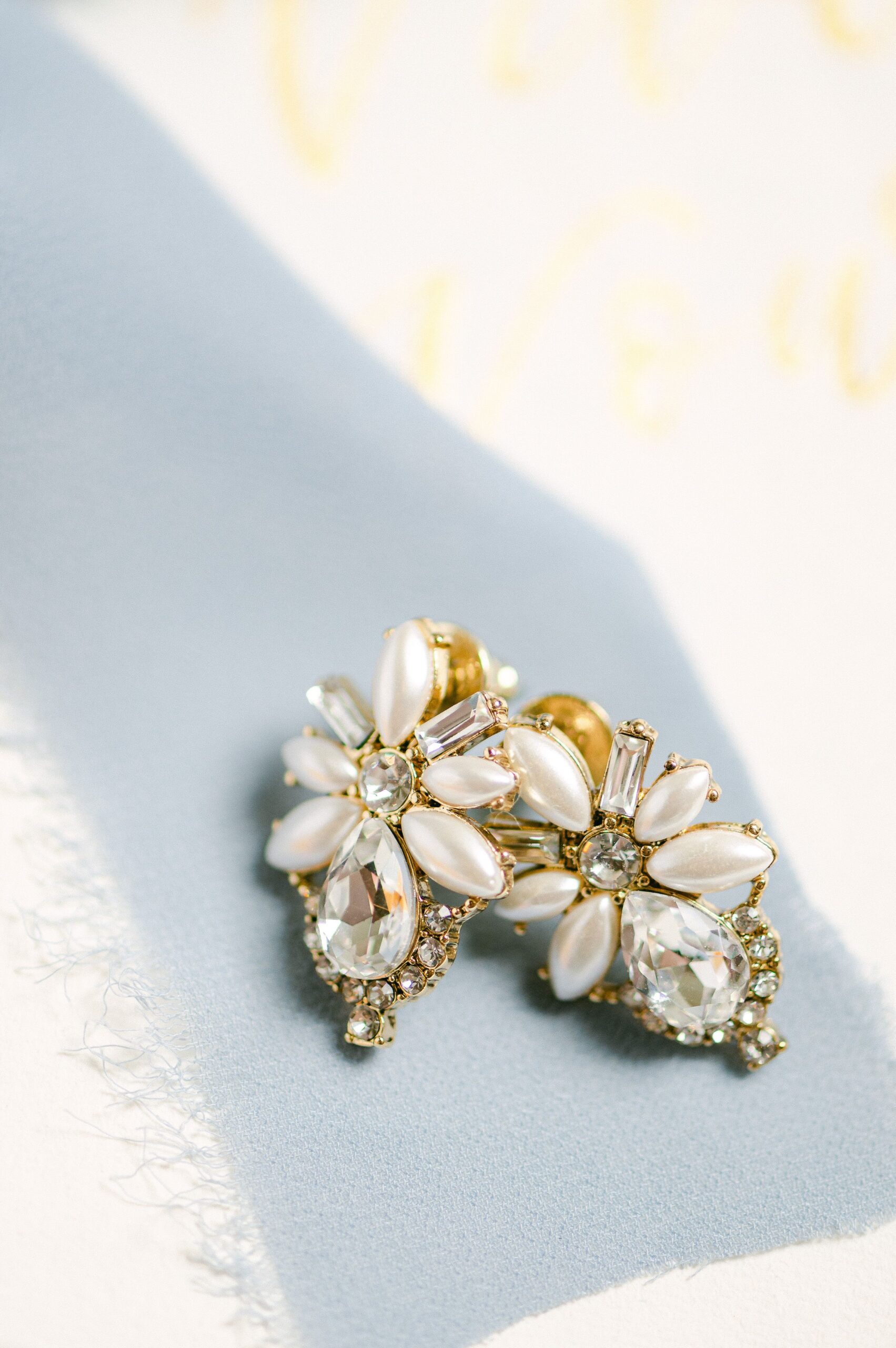 wedding earrings on blue ribbon