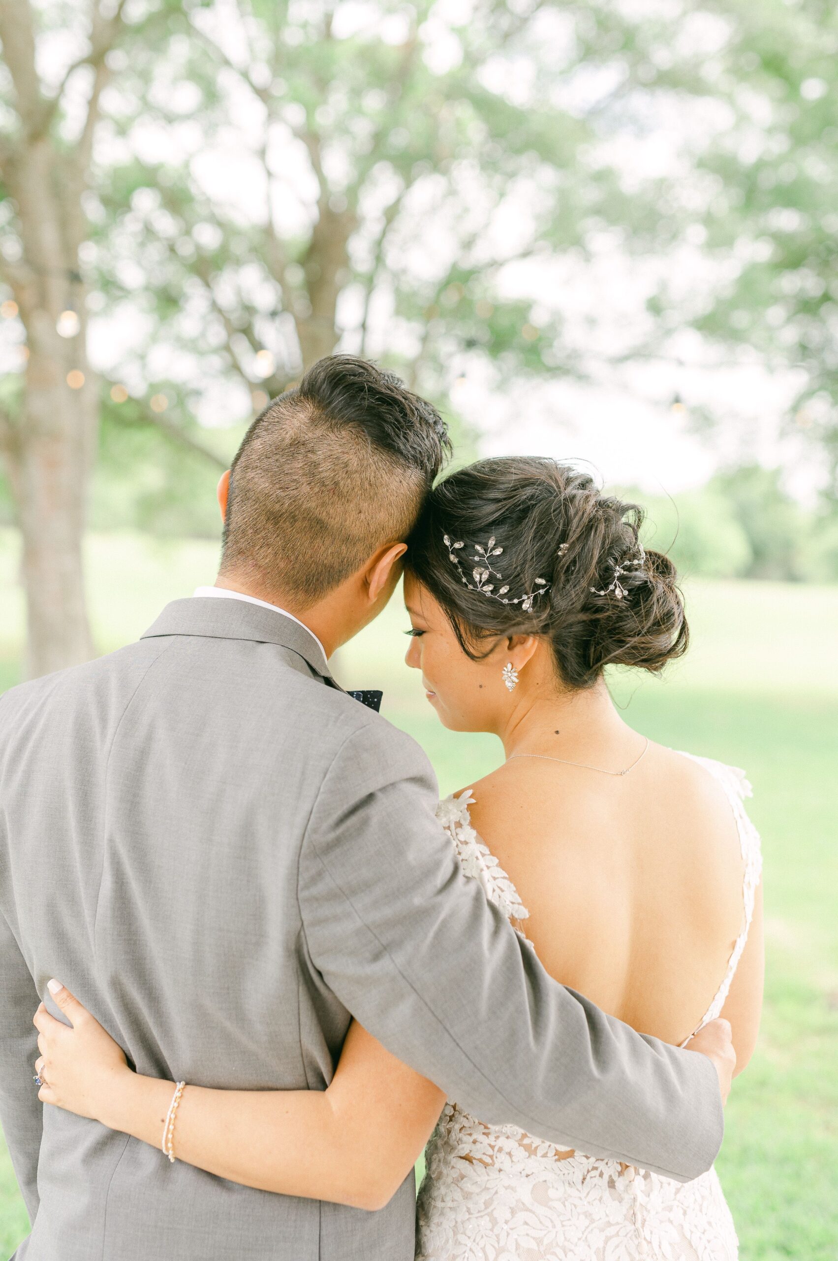 bride and groom cuddling at their wedding in Santa Fe, Texas