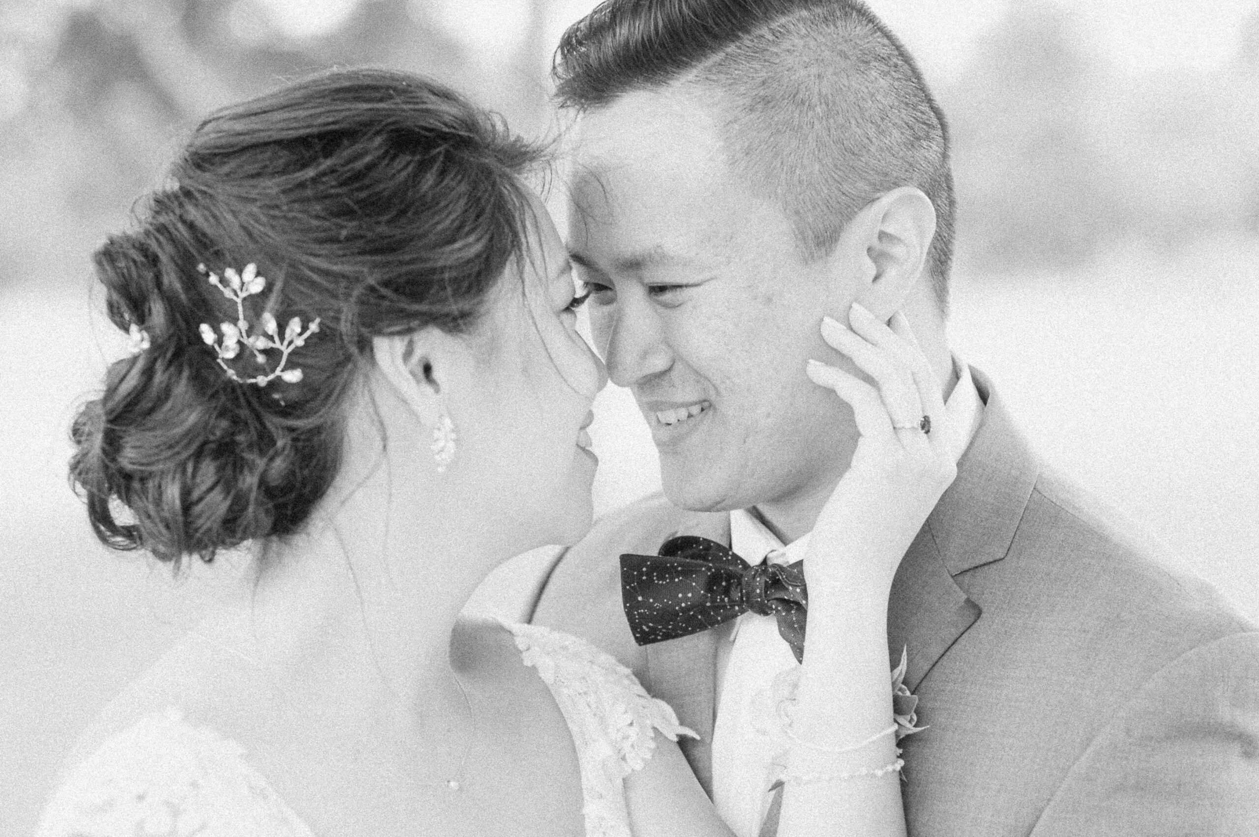 bride and groom cuddling at their wedding in Santa Fe, Texas