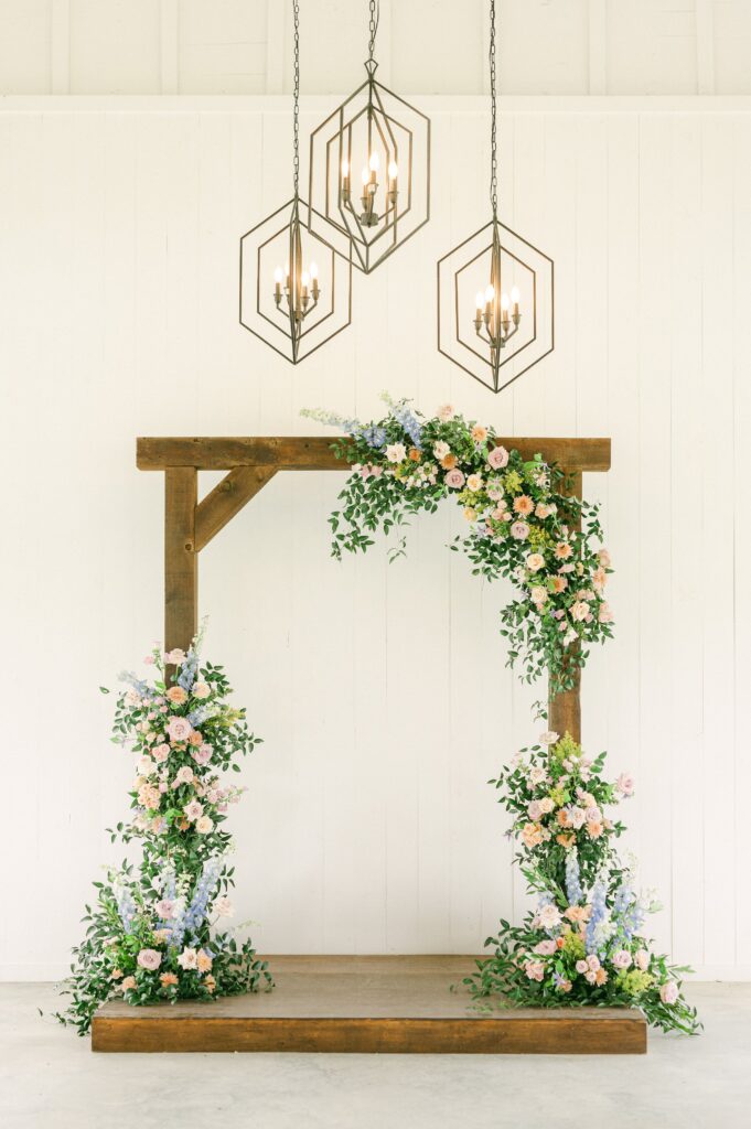 bright spring flowers on wedding arch
