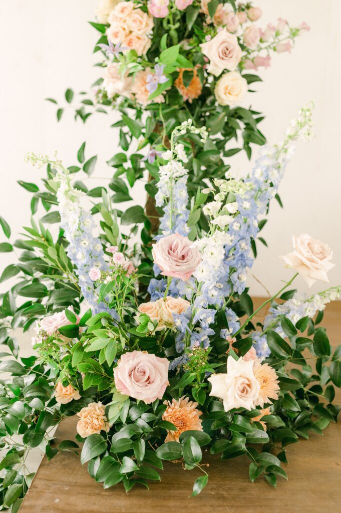 bright spring flowers on wedding arch