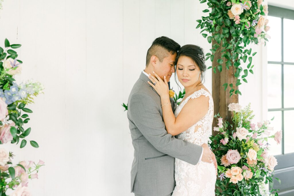 bride and groom cuddling at spring wedding