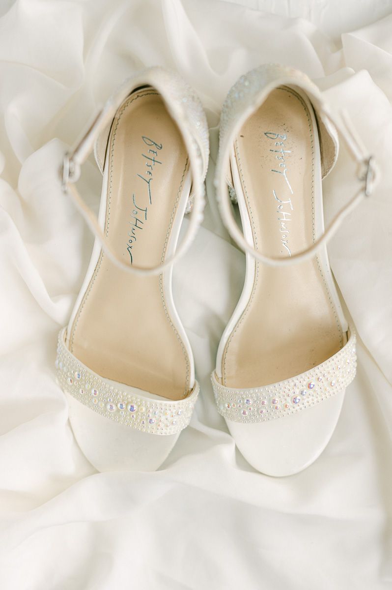 bridal shoes on white fabric