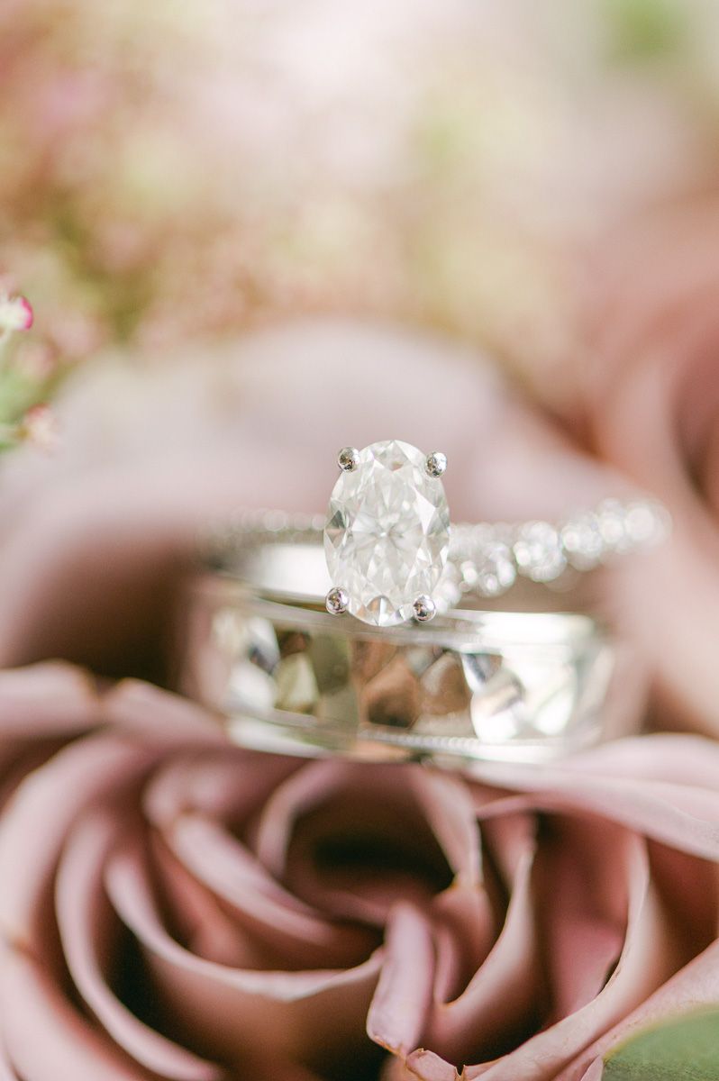 wedding rings on dusty pink flower