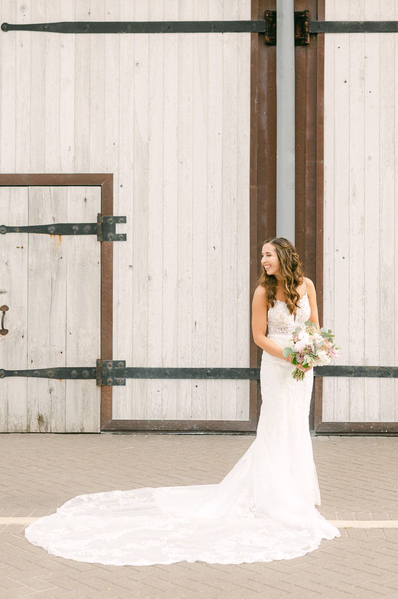 bride holding bouquet outside Beckendorff Farms in Katy, Tx