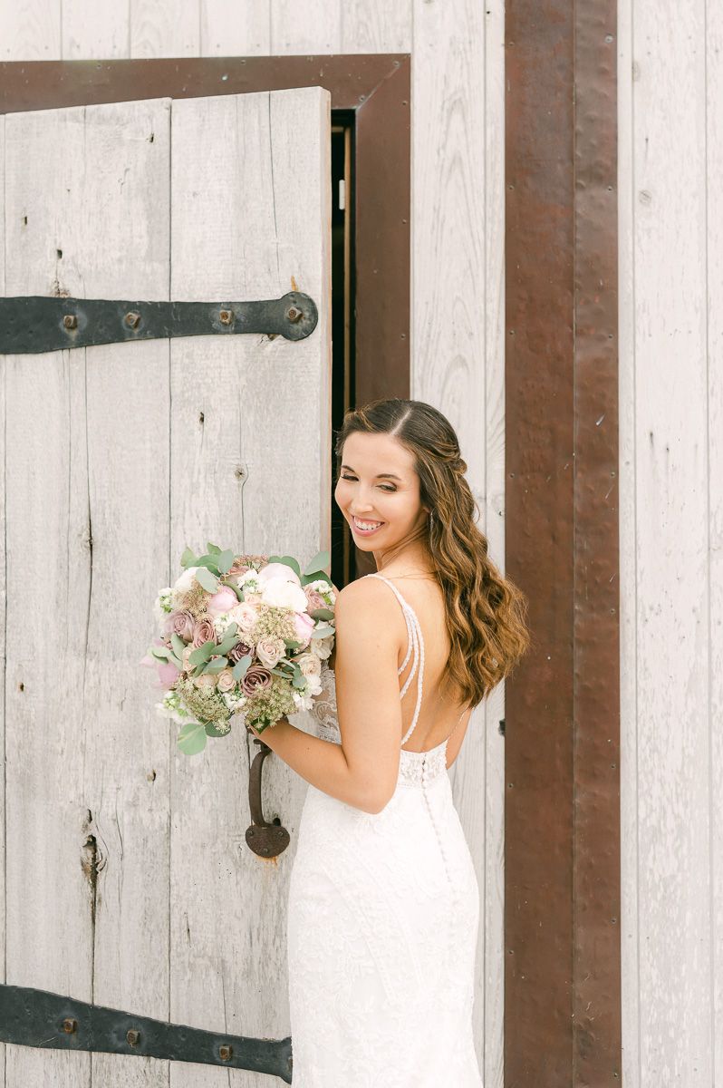 bride holding bouquet outside Beckendorff Farms in Katy, Tx
