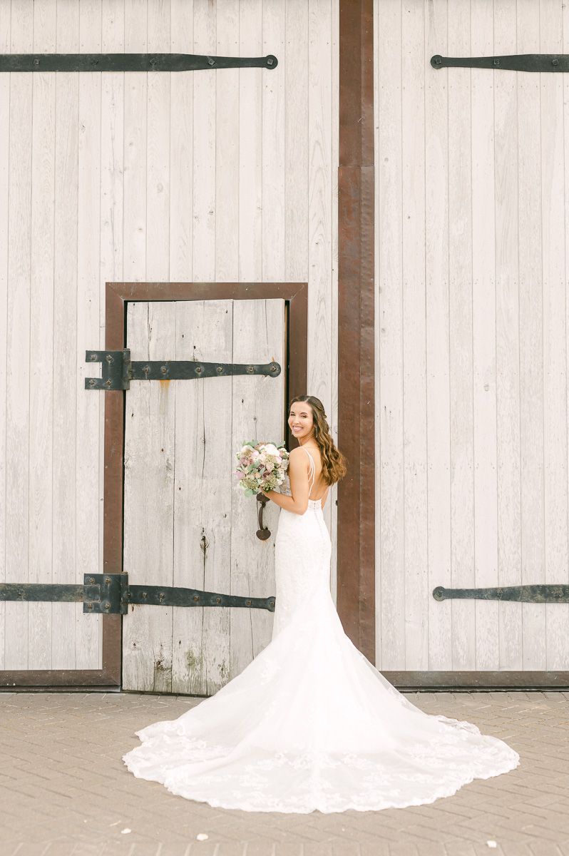 bride holding bouquet outside Beckendorff Farms in Katy, Tx