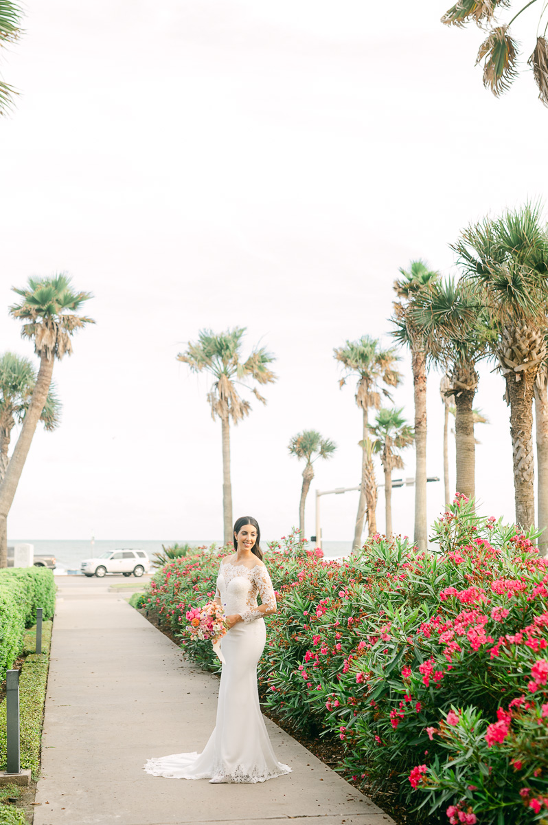 a bride in front of the ocean in galveston