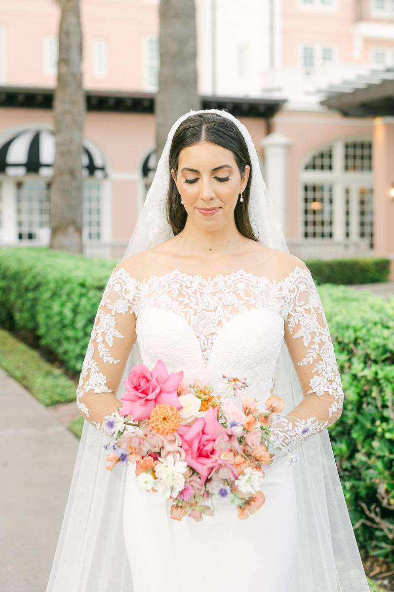 a bride wearing a classic veil and lace dress