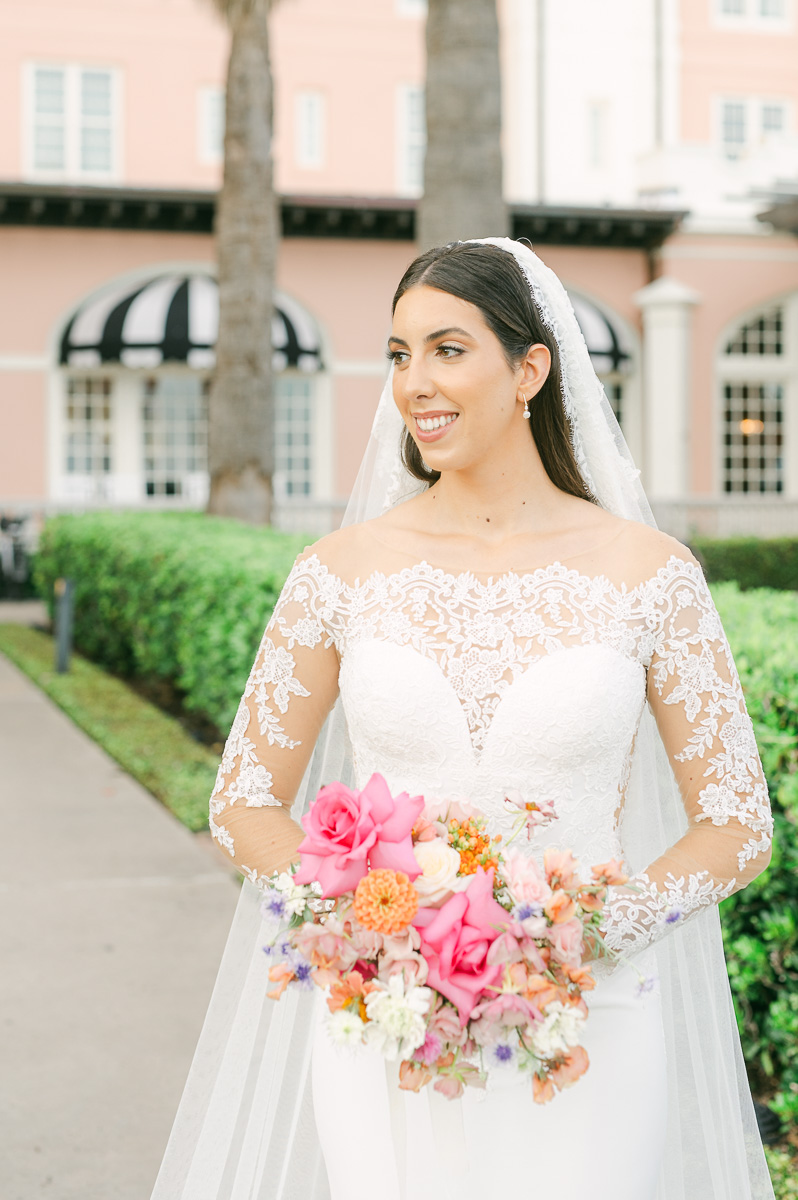 a bride wearing a classic veil and lace dress