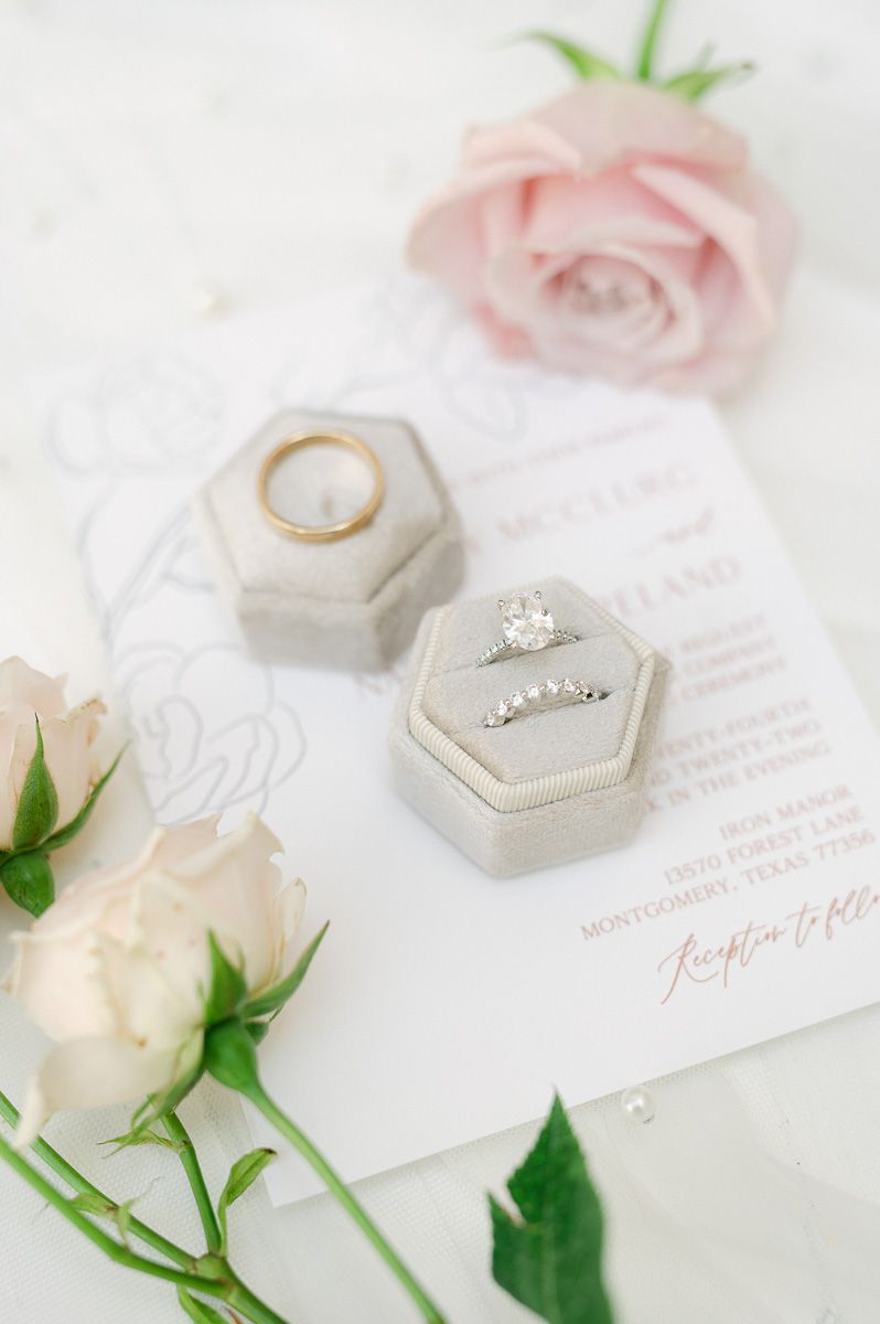 wedding rings in cream box on invitation