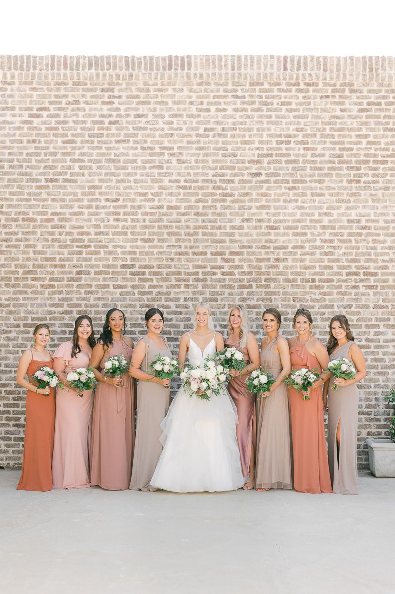 bridesmaids is different colored dresses at Montgomery, Tx wedding