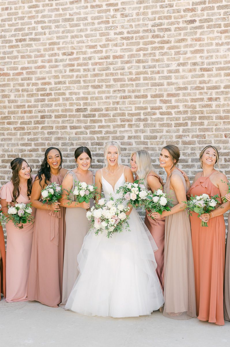 bridesmaids is different colored dresses at Montgomery, Tx wedding