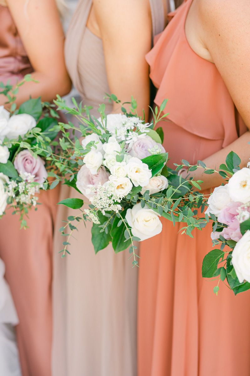 bridesmaids is different colored dresses at Montgomery, Tx wedding