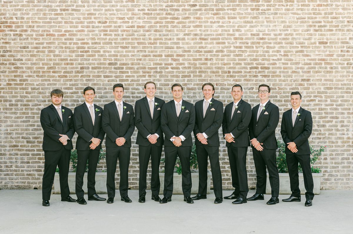 groomsmen in black suits at Montgomery, Tx wedding
