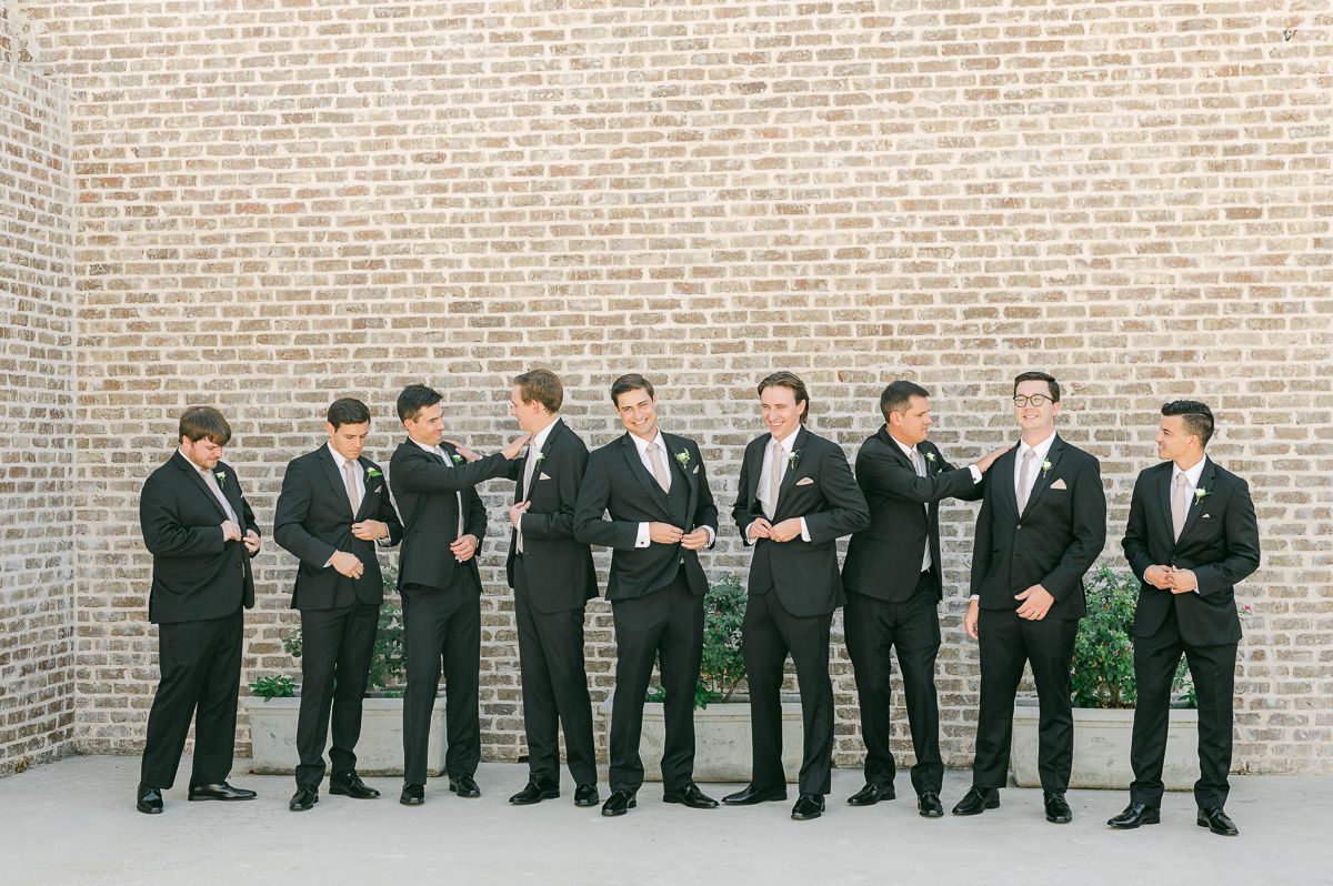 groomsmen in black suits at Montgomery, Tx wedding