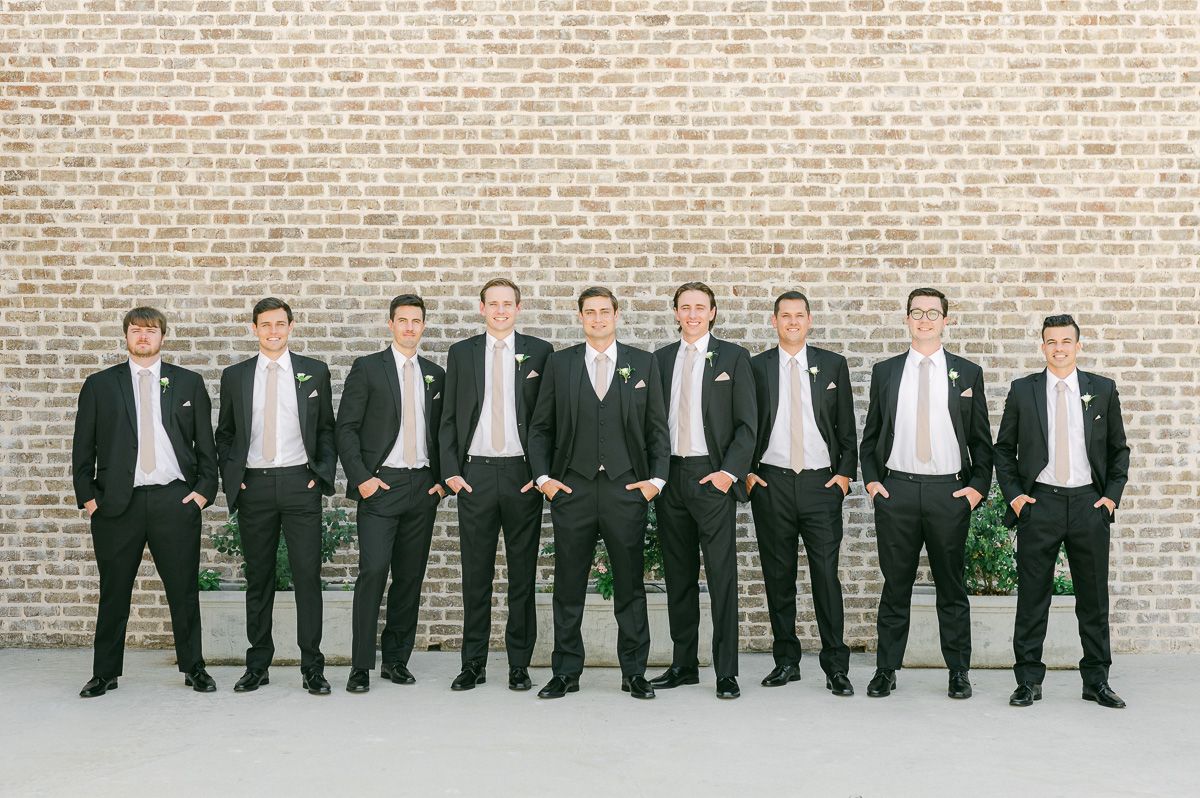 groomsmen in black suits at Montgomery, Tx wedding