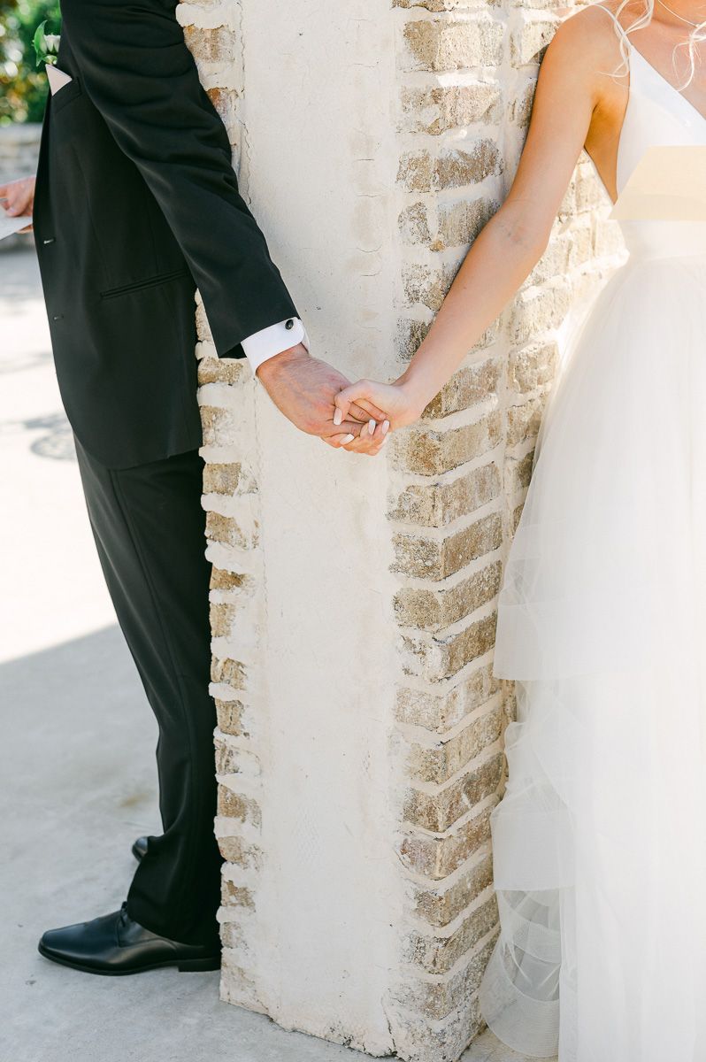 first touch between bride and groom at Iron Manor wedding venue