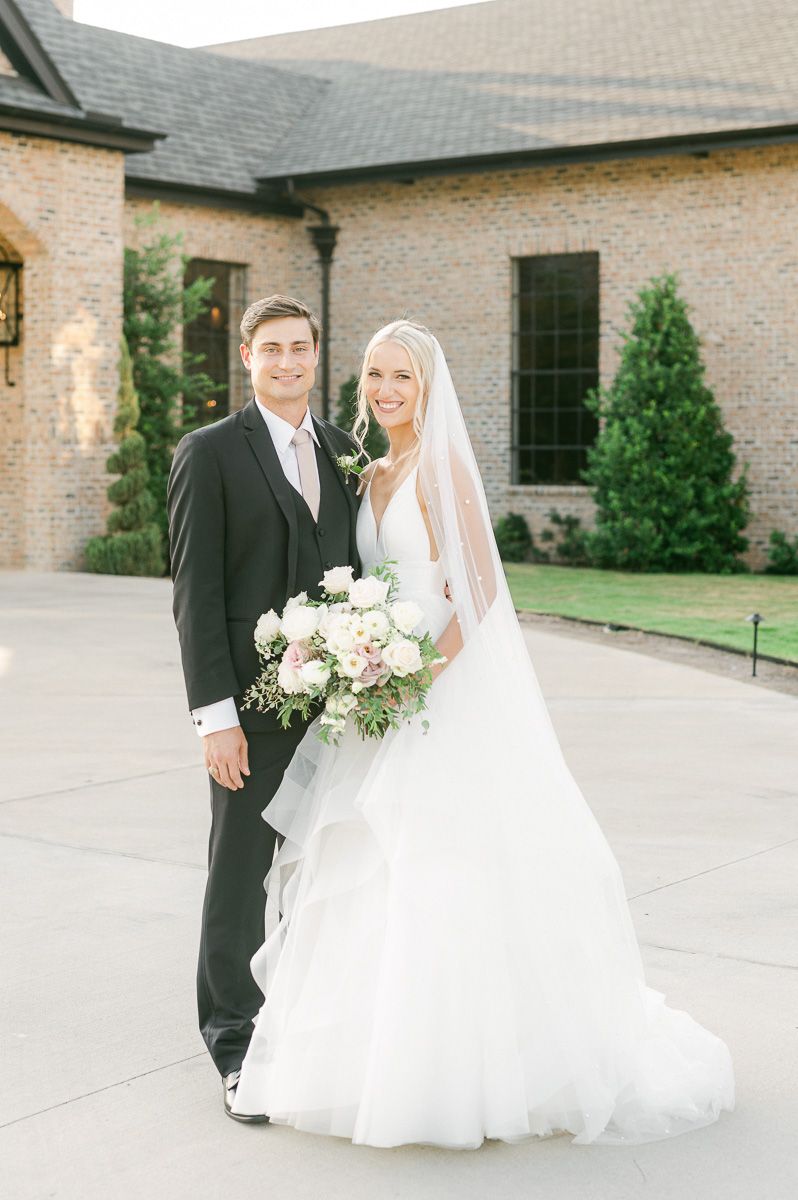 bride and groom outside Iron Manor wedding venue