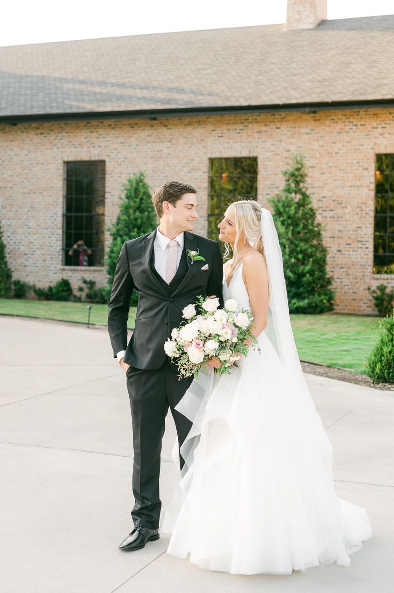 bride and groom outside Iron Manor wedding venue