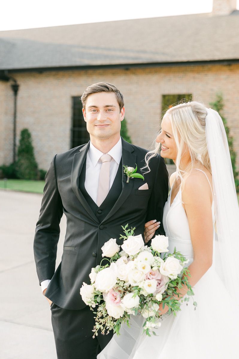bride and groom outside Iron Manor wedding venue