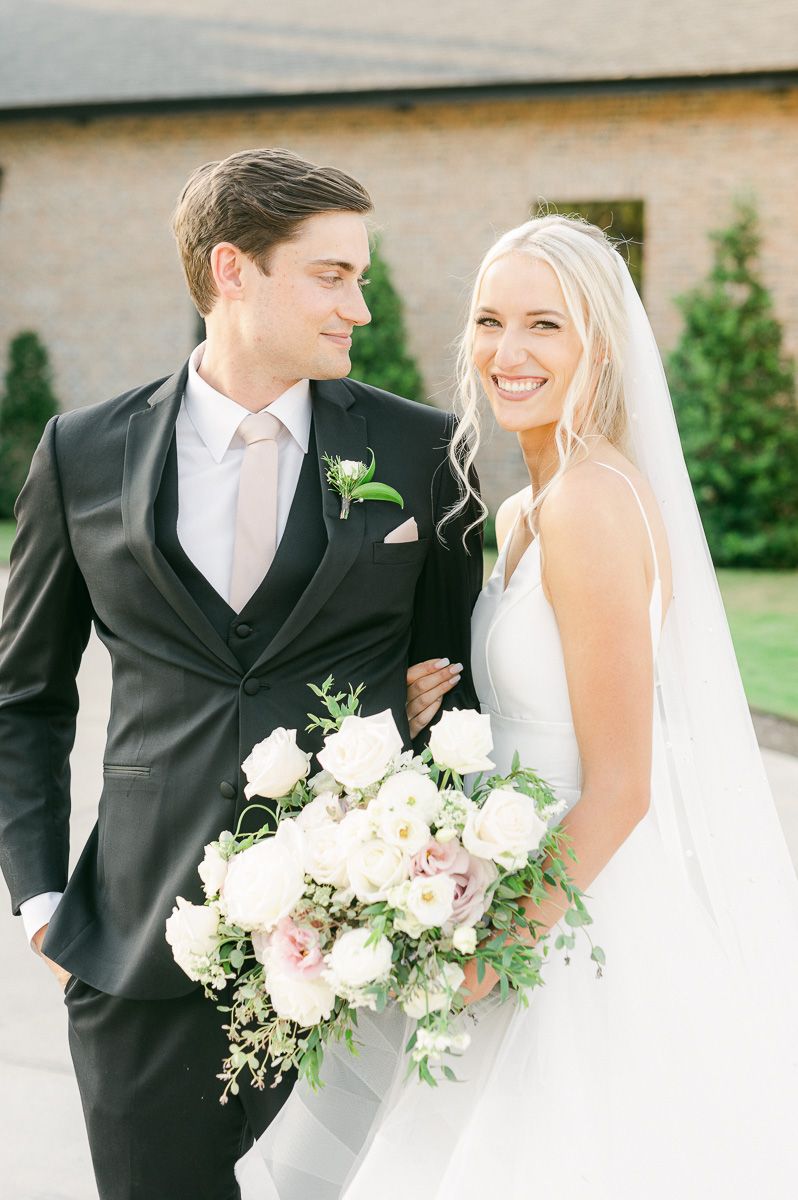 bride and groom outside Iron Manor wedding venue